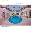 Featured in Schiffer Publishing, Ltd.'s International Award Winning Pools, Spas, & Water Environments II, this indoor pool blends round and oval sections, warm lighting, mural art, and windows to evoke an outdoor atmosphere.