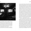 A dimly lit, vintage bar with empty chairs and tables sets a quiet scene. At the counter, a lone figure suggests ghostly tales—an atmosphere echoed in "Skeleton Keys" by Schiffer Publishing, Ltd., with descriptive text surrounding the image.