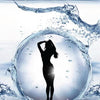 A woman’s silhouette poses within a swirling splash of water, droplets surrounding her as radiant light shines behind—evoking spiritual energy—illustrating the essence of Psychic Sex.