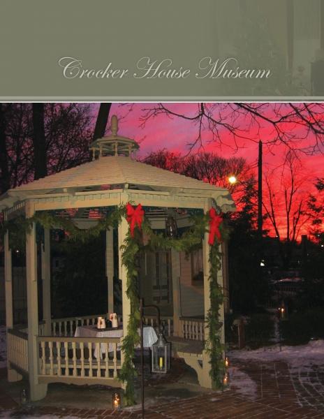 Decorating for Christmas at Historic Houses" by Schiffer Publishing, Ltd. captures the charm of festive gazebos adorned with green garlands and red bows, set against vibrant red and purple dusk skies, evoking timeless holiday traditions.