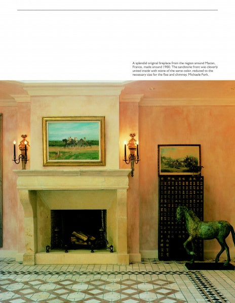 A grand stone Schiffer Publishing, Ltd. Fireplace with a painting above and wall sconces on each side, set in a salmon-walled room with patterned tile floor, decorative folding screen, and a life-sized horse sculpture.