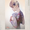 A woman with short blonde hair, hoop earrings, and bold tattoos poses for Ink ’N Girls by Schiffer Publishing, Ltd., showcasing vibrant body art and script tattoos—a striking example of tattooed women.