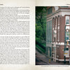 An open book, "Haunted Charlotte" by Schiffer Publishing, Ltd., displays text on the left and a photo of a historic brick building on a peaceful tree-lined city corner on the right—hinting at eerie tales with empty sidewalks and no people in sight.
