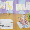 A startled purple cat and a green monster watch a boy leap from the page, with animal sketches in the background—like an imaginative scene from "Gruel Snarl Draws a Wild Zugthing" by Schiffer Publishing, Ltd.