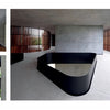 Showcasing the sculptural architecture of stairs and interiors, Concrete Houses by Schiffer Publishing, Ltd. features minimalist spaces with smooth concrete walls and floors, black metal railings, and vertical wood slats letting in natural light.