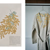 Left: Juno's Nature Embroidery Notebook by Schiffer Publishing, Ltd. shows detailed yellow mimosa and green leaf embroidery. Right: The cover displays similar mimosa designs on beige linen, set against a plain white background.