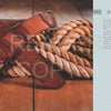 The book "A Guide to Making Leather Belts with 12 Complete Projects" by Schiffer Publishing, Ltd. is displayed on a wooden surface beside coiled tan ropes; its description appears on the right against a light background.