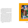 A young boy in glasses and a green shirt, wearing race bib 16, smiles and celebrates mid-race—capturing the spirit featured in "Reasons to Smile, 2nd Edition" by Schiffer Publishing, Ltd., as supporters cheer him on.