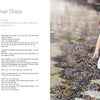 A girl wears a white dress featuring Scandinavian knitting patterns from "Summer Knitting for Little Sweethearts" by Schiffer Publishing, Ltd., crafted with soft merino wool yarn.