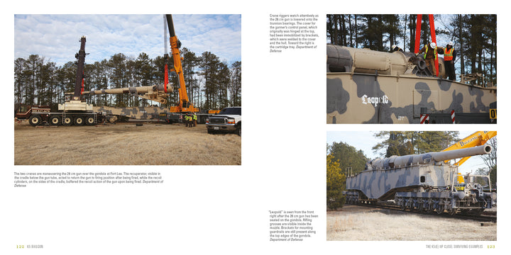 A large crane lifts the K5 Rail Gun by Schiffer Publishing, Ltd. as workers assist; the massive railway gun is later placed on train tracks outdoors, surrounded by grass and trees beneath a clear sky.